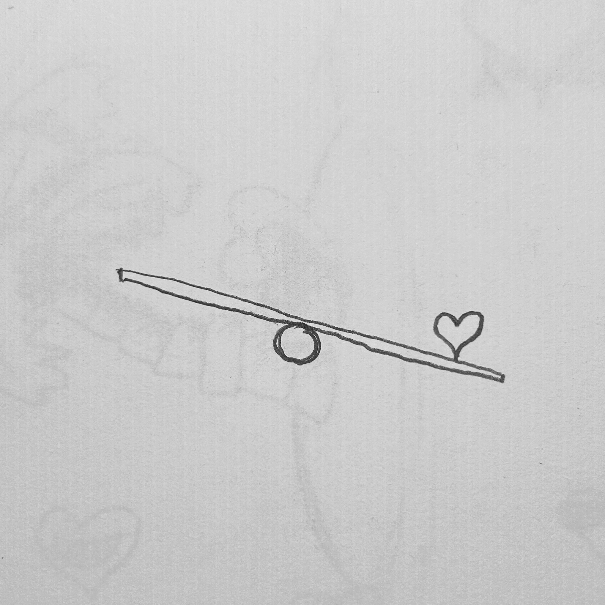 Heart on one end of a seesaw