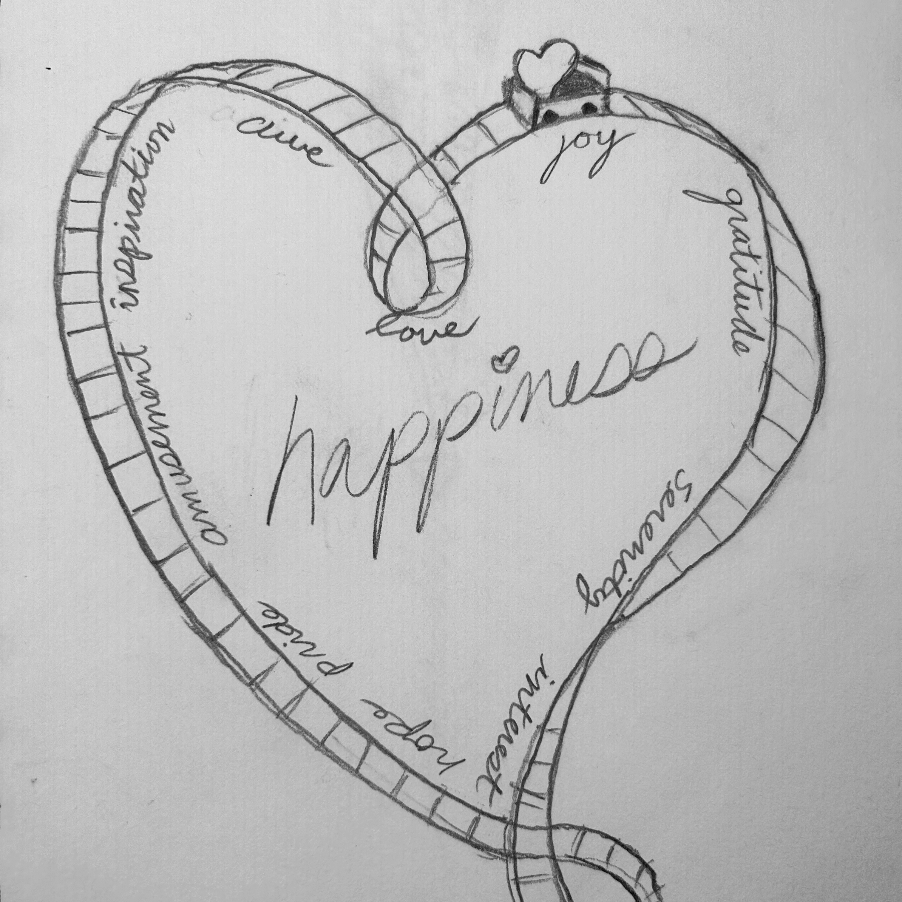 Heart shaped roller coaster track with words and a train car
